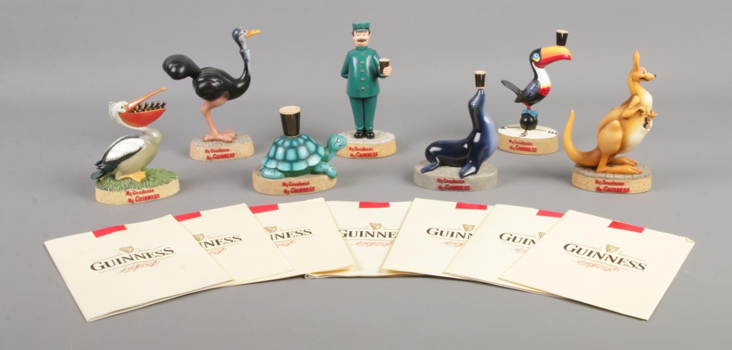 A set of seven boxed Enesco Guinness advertising figures, each on 'My Goodness My Guinness' base. To