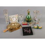 A quantity of collectables including brass crumb scoop, assorted glassware, quartz clock, costume