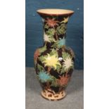 A large floor vase decorated with painted floral decoration. Height 83cm.