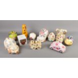 A collection of novelty money boxes including pigs, fish, eggs, etc. Approx. 12 pieces.
