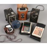 Three Kodak Brownie cameras and a Weston Master III light meter. Includes Reflex, Model C, etc.