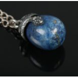 A Lapiz Lazuli egg with serpent mount on white metal chain. Marked 84 to mount (possibly Russian