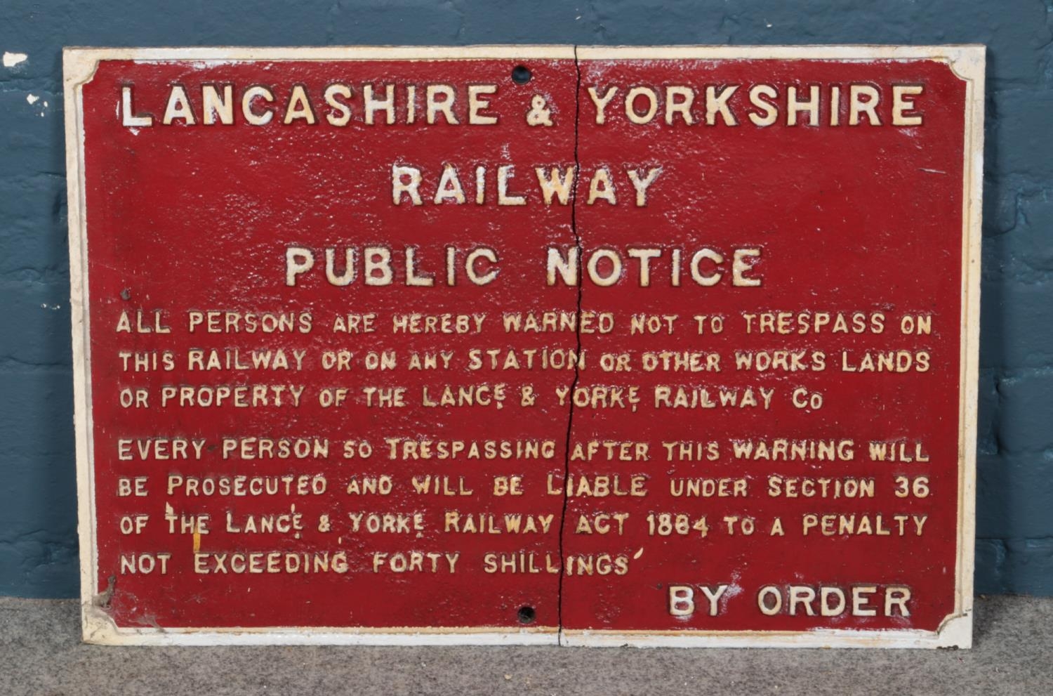 A cast iron white on red Lancashire & Yorkshire Railway public notice and trespass sign. Height: