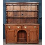 A Nineteenth century pine dresser, with two drawers and cupboard doors to the base. Height: 177cm,