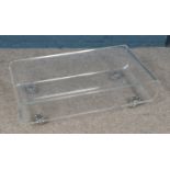 A clear acrylic/Perspex two-tier coffee table. Approx. dimensions 83cm x 50cm x 26cm.