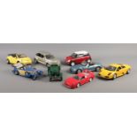 A collection of assorted larger scale model vehicles. To include Ferrari F40, Chrysler PT Cruiser