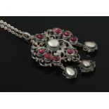 A nineteenth century silver, mother of pearl and garnet pendant. Total weight: 15.6g