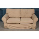 An Ikea two seat sofa with beige cover. (90cm x 176cm)