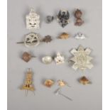 A quantity of military cap badges and pins including The Royal Highlander Black Watch, King Edward's