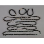 A quantity of black onyx, French jet and smokey quartz bracelets and necklaces. Approx. 7 total.
