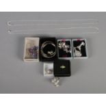 A quantity of silver jewellery and collectables to include thimble, christening bangle, rings,