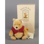 A boxed Steiff Classic Winnie The Pooh bear. Limited Edition 06,540/10,000.
