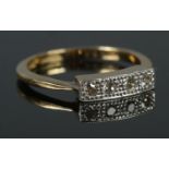 An 18ct Gold and Platinum four stone Diamond ring, in illusion set border. Size J. Total weight: 2.
