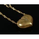 A 9ct gold heart pendant and 9ct gold chain. 0.91g. Chain snapped.