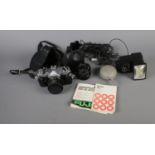 A Fujica STX-1 camera in case along with Fuji 1:2.8 lens and Vivitar thyristor flash. Includes