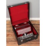 A Chanson accordion with carry case. Tone variation.
