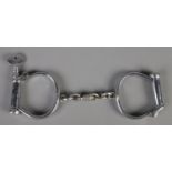 A pair of antique Dowler police handcuffs with key.