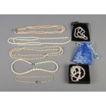 A collection of simulated pearl necklaces, bracelets and earrings.