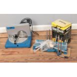 A Nu Tool MS200 miter saw, BernzOMatic oxygen torch kit and bench saw.