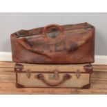 A large Gladstone type bag stencilled EAEL, along with a vintage suitcase.