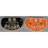 Two cast iron locomotive plates. Including 'S.R. Standard 12 Tons 65988' and 'C.W.R. Standard 12