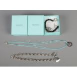 A quantity of Tiffany and Co style necklaces and bracelets, all with boxes. Includes choker style