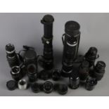 A box of camera lenses. Including large Photax, Pentacon, Hanimex, Carl Zeiss, etc.