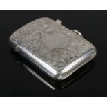 An Edwardian silver vesta case, assayed for Birmingham 1902 by JB&Co. Floral decoration to the case,