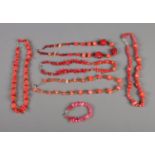 A quantity of coral necklaces and one bracelets.