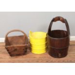 Three wooden buckets including metal banded pail and painted yellow example.