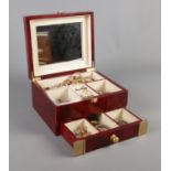 A hinged jewellery box, with contents of costume jewellery to include chains, cufflinks, bracelets
