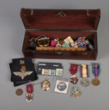 A box of collectables including rolled gold locket, German WWII stamps, Masonic medals,