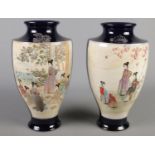 A pair of large blue ground Japanese Satsuma style vases. Decorated with hand painted figures. (