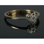 An 18ct Gold and Diamond daisy cluster ring. Size N. Total weight: 1.7g