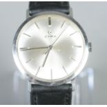 A boxed gentleman's stainless steel Cyma manual wristwatch. Working order. Good condition. Box hinge