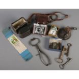 A small quantity of collectables. Including old keys, hand painted miniature clock, Jdeal camera,