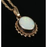 A 9ct gold opal pendant on chain. Gross weight 1.82g.