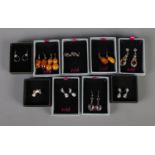 Ten boxed pairs of silver earrings including amber coloured examples. All stamped 925.