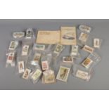 A collection of cigarette cards including two complete albums of John Players Motor Cars and Films