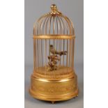 A late Twentieth Century Reuge Music Swiss clockwork bird in cage automation. Stamped underneath