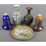 Four pieces of Chinese ceramics along with a large Cloisonne vase. Includes two unusual bell