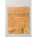 A vintage wooden industrial sign entitled Compressed Air is Dangerous. Approx. dimensions 61cm x