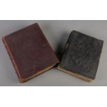 Two leather bound family bibles. Both with monochrome plates.
