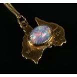 A 9ct gold pendant formed as Australia with central opal on 9ct gold chain. Gross weight 1.99g.