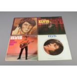 Four Elvis Presley vinyl records including From Elvis in Memphis, Welcome To My World, A Legendary