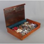 A bijouterie case containing a very good assortment of collectables, to include teething ring,