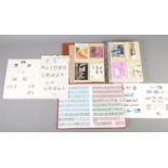 Seven albums of Royal Mail postcards along with three albums of British and world stamps.