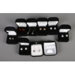 Eight boxed pairs of silver earrings of mainly studded examples. All stamped 925.
