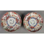 A pair of 19th century Japanese Imari plates. Baring four character marks to the base.