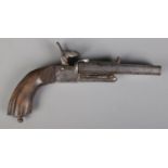 A 19th century Continental double barrel percussion cap pistol. Length 21cm. CANNOT POST OVERSEAS